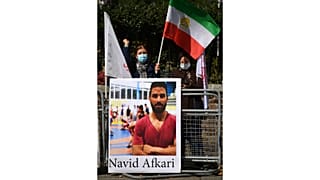 Demonstraters against the execution of Iranian wrestler Navid Afkari gather outside the Iranian embassy in London on September 12, 2020.
