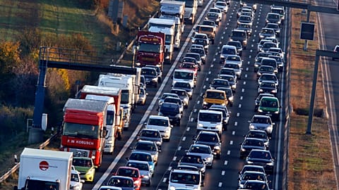 In this Nov. 6, 2017 file photo cars and trucks queue on the highway A5 in Frankfurt, Germany. 