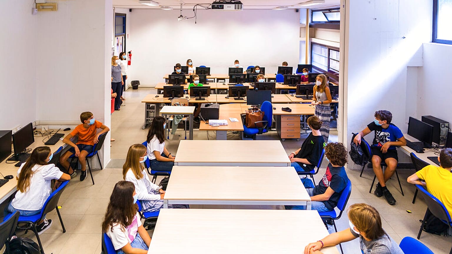 Pupils listen to teachers on their first day of school at the high school Giovanni Battista Morgagni in Rome, Monday, Sept. 14, 2020
