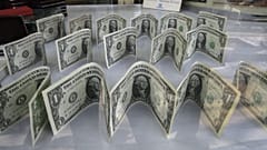 US dollars decorate a foreign currency exchange bureau, in Ferdowsi St. in downtown Tehran, Iran