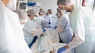 Medical workers tend a patient affected with the COVID-19 in the Nouvel Hospital Civil of Strasbourg, eastern France, Tuesday, Sept.15, 2020.