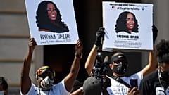 Signs are held up showing Breonna Taylor during a rally in her honour on the steps of the Kentucky State Capitol in Frankfort, Ky., Thursday, June 25, 2020. 
