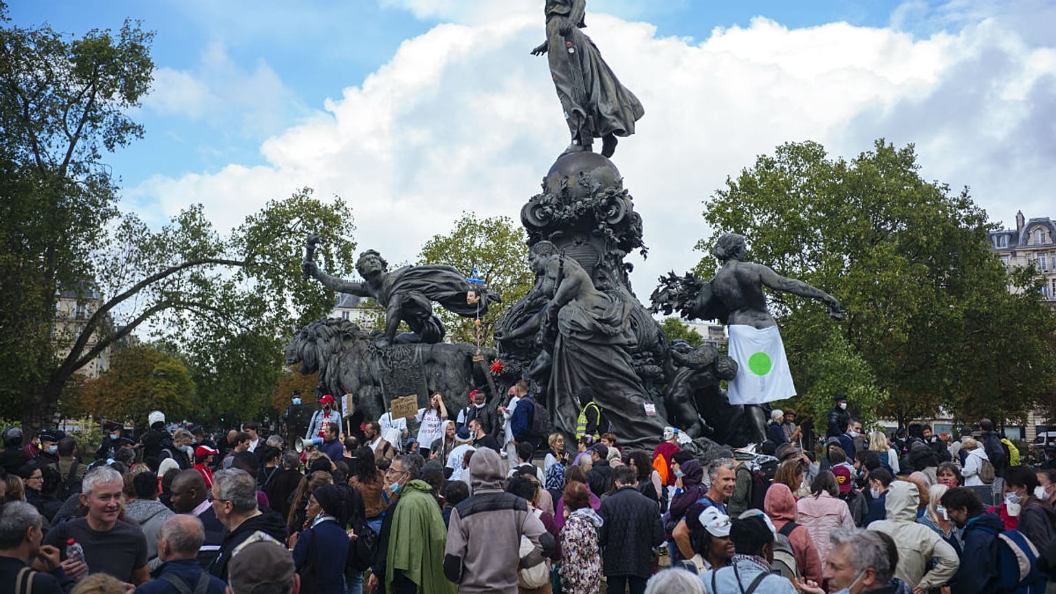 Demonstrators gather during an anti-mask demonstration in Paris