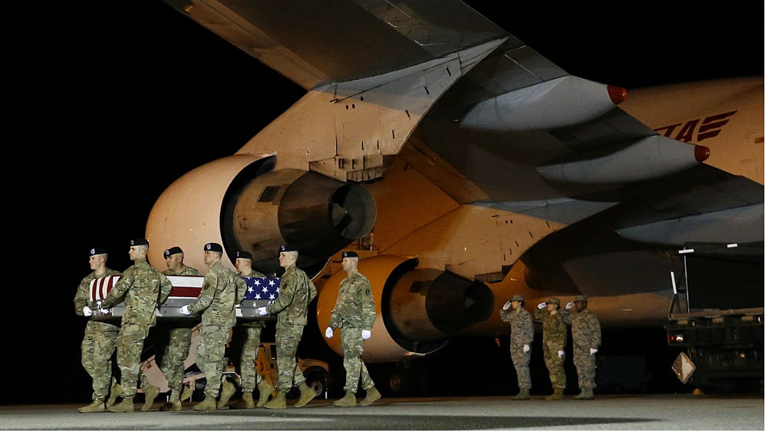 A U.S. Army carry team moves a transfer case containing the remains of Sgt from Afghanistan.