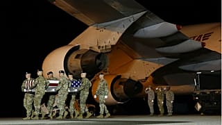 A U.S. Army carry team moves a transfer case containing the remains of Sgt from Afghanistan.