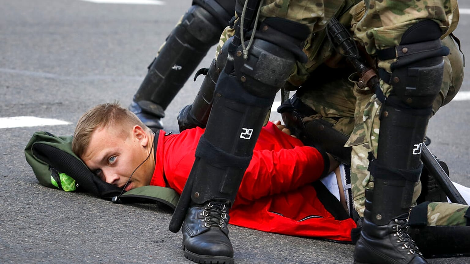 A protester is detained in Minsk during a Belarusian opposition supporters' rally on September 13