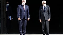 German President Frank-Walter Steinmeier, is flanked by Italian President Sergio Mattarella after visiting the Duomo gothic cathedral, in Milan, Italy, Sept. 17, 2020