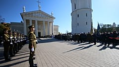 An honor guard stand as the coffin of the commander of the 1944-1953 partisan resistance movement against Soviet occupation, Adolfas Ramanauskas.