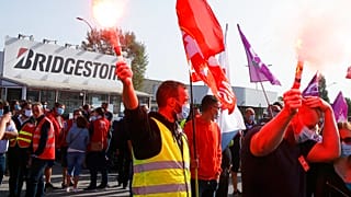 Bridgestone employees gather outside the tire factory of Bethune, northern France, Thursday, Sept.17, 2020