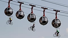 Performers dressed as riders pedal during the start of stage 17 of the Tour de France cycling race over 170 kilometres, starting in Grenoble. September 16, 2020