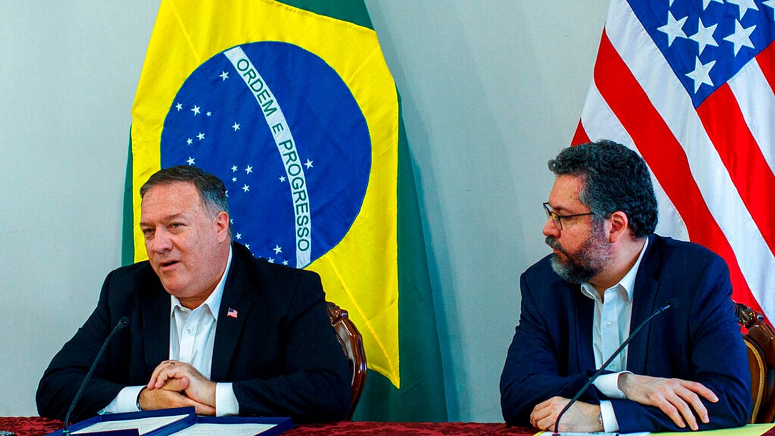 U.S. Secretary of State Mike Pompeo speaks as Brazilian Foreign Minister Ernesto Araujo looks on during a press conference at the Boa Vista Air Base in Roraima, Brazil