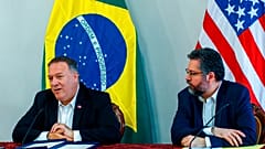 U.S. Secretary of State Mike Pompeo speaks as Brazilian Foreign Minister Ernesto Araujo looks on during a press conference at the Boa Vista Air Base in Roraima, Brazil