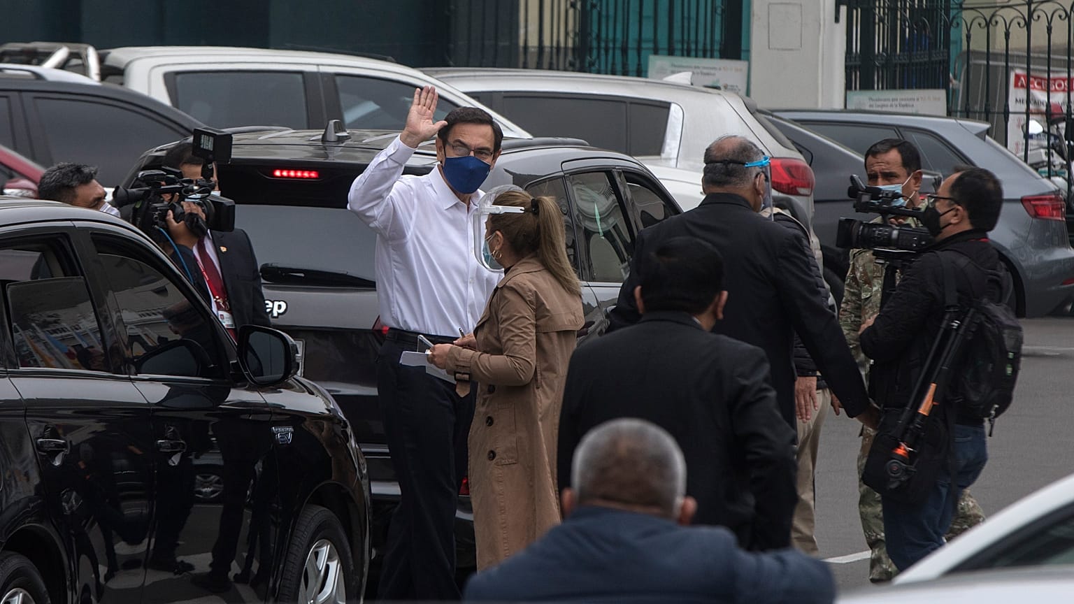 Peru's President Martin Vizcarra greets reporters after addressing Congress in Lima, Peru, Friday, Sept. 18, 2020.