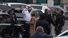 Peru's President Martin Vizcarra greets reporters after addressing Congress in Lima, Peru, Friday, Sept. 18, 2020.
