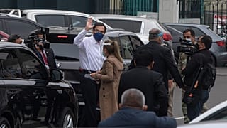 Peru's President Martin Vizcarra greets reporters after addressing Congress in Lima, Peru, Friday, Sept. 18, 2020.