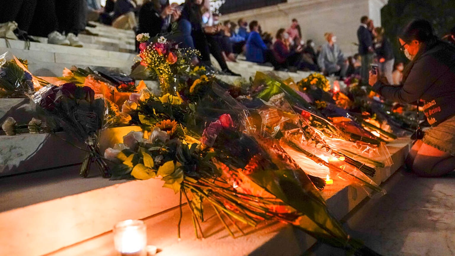 People gather at the Supreme Court Friday, Sept. 18, 2020, in Washington, after the death of the Supreme Court Justice judge Ruth Bader Ginsburg