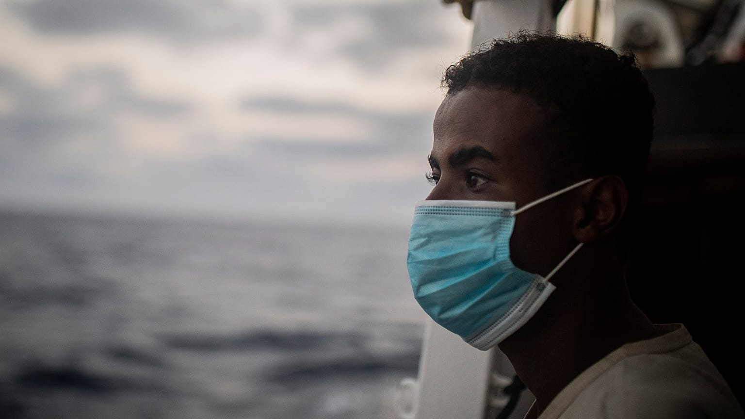 A migrant from Somalia after being rescued from the Mediterranean having fled Libya.