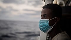 A migrant from Somalia after being rescued from the Mediterranean having fled Libya.