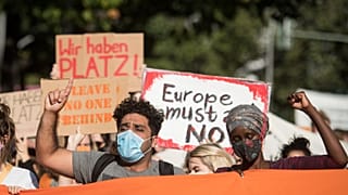 Protesters demonstrate for the evacuation of all migrant camps in Greece after the fire at the Moria refugee camp on Lesbos, on September 20, 2020, in Berlin.