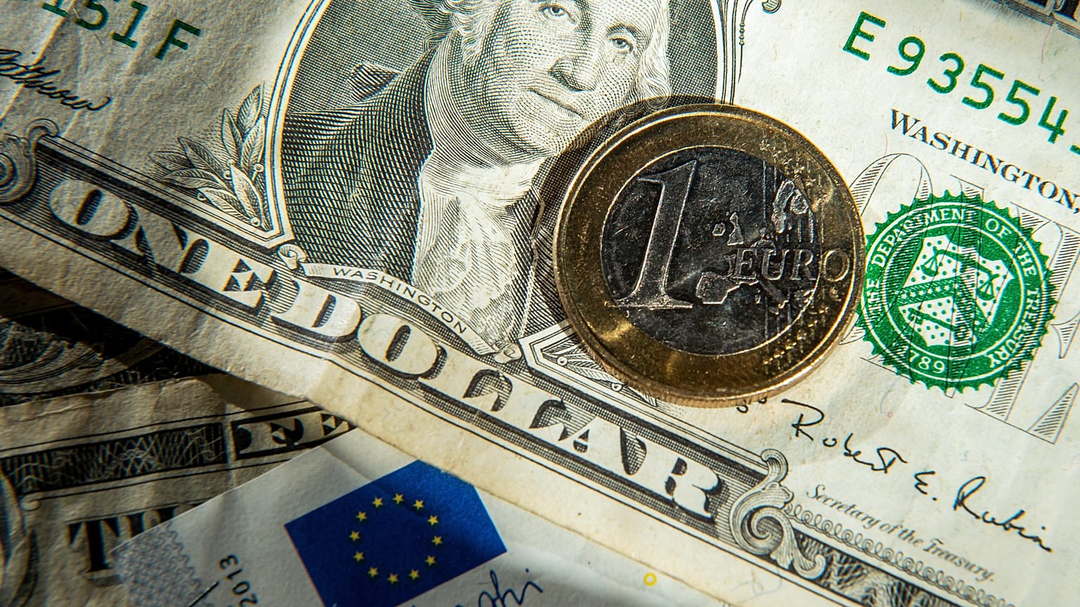 This file photo taken on January 17, 2015 shows euros and US dollar bills taken in Godewaersvelde, Northern France. 