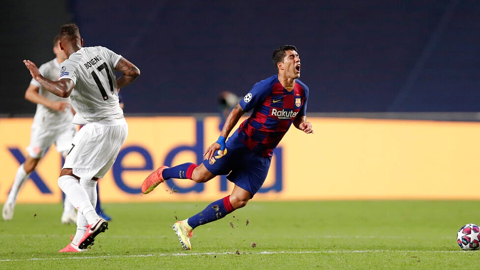 Barca striker Luis Suarez on his way to the turf in game between FC Barcelona and Bayern Munich at the Luz stadium in Lisbon, Portugal, Friday, Aug. 14, 2020