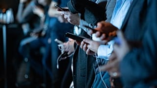 People looking at their phones.