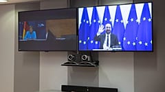 European Council President Charles Michel, screen right, waves as he attends a video conference with German Chancellor Angela Merkel, Sep 22 2020