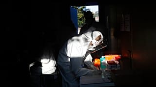 A healthcare worker at a sampling station for COVID-19 in Prague, Czech Republic, Monday, Sept. 21, 2020. 