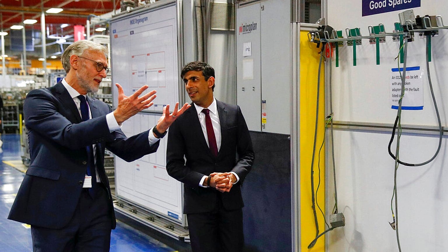 Rishi Sunak talks with the CEO of Worcester Bosch, Carl Arntzen, left, during a visit to Worcester Bosch factory to promote the initiative, Plan for Jobs