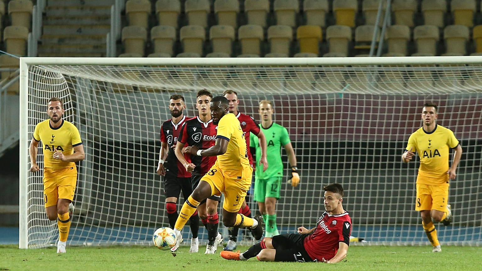 Tottenham's Tanguy Ndombele is takled by Shkendija's Arbin Zejnulai during a Europa League third qualifying round match.