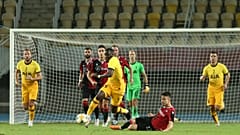 Tottenham's Tanguy Ndombele is takled by Shkendija's Arbin Zejnulai during a Europa League third qualifying round match.