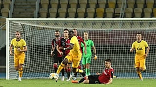 Tottenham's Tanguy Ndombele is takled by Shkendija's Arbin Zejnulai during a Europa League third qualifying round match.