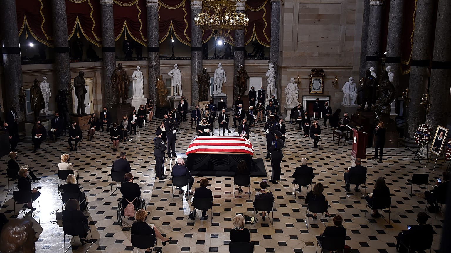 A U.S. Capitol Police honor guard surrounds the flag-draped casket of Justice Ruth Bader Ginsburg as lies in state in Statuary Hall of the U.S. Capitol, Friday, Sept. 25, 2020