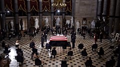 A U.S. Capitol Police honor guard surrounds the flag-draped casket of Justice Ruth Bader Ginsburg as lies in state in Statuary Hall of the U.S. Capitol, Friday, Sept. 25, 2020