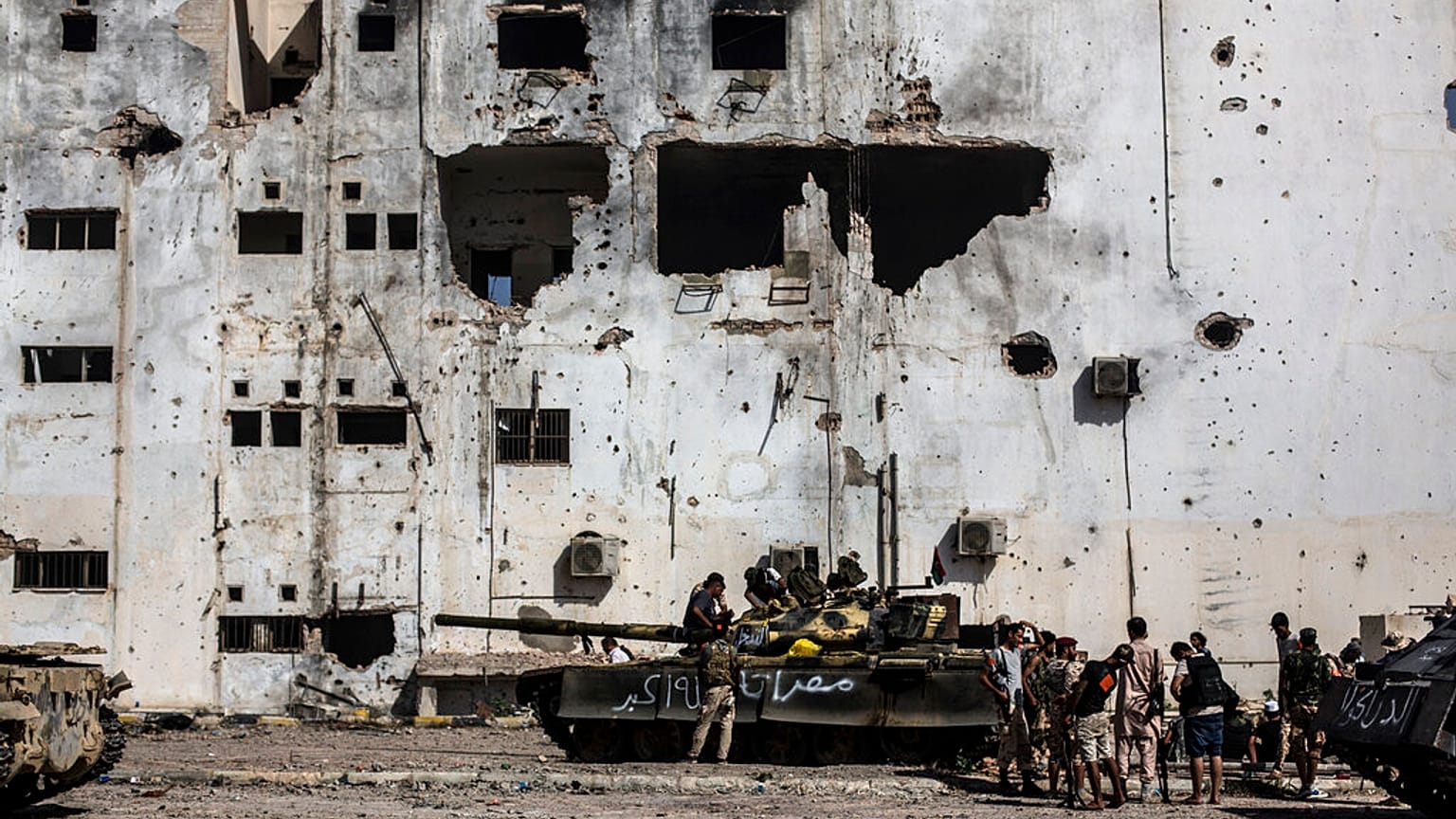 In this Sept. 22, 2016 file photo, fighters of the Libyan forces affiliated to the Tripoli government rest and reload weapons during an offensive against Islamic State.