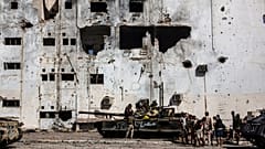 In this Sept. 22, 2016 file photo, fighters of the Libyan forces affiliated to the Tripoli government rest and reload weapons during an offensive against Islamic State.