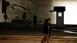 A couple wearing face masks against the spread of the coronavirus