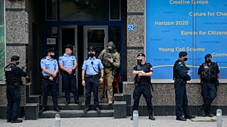 Kosovo police guard the entrance of the offices of a war veterans association in Kosovo, in Pristina.