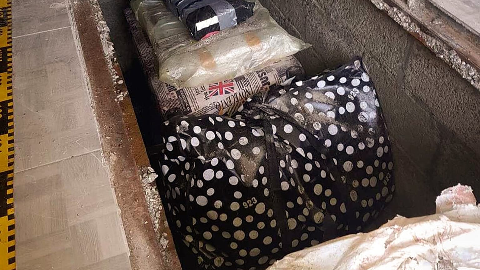 In this undated image provided by the Romanian Police a view of some 200 rare and valuable books discovered Wednesday, Sept. 16, 2020 hidden under a house in rural Romania