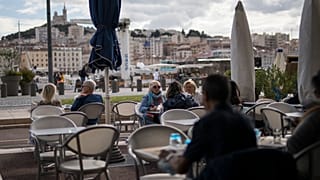People enjoy refreshments at a restaurant, in Marseille