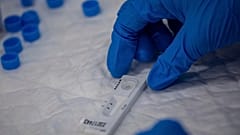 A Madrid Emergency Service (SUMMA) health workers conducts a rapid antigen test for COVID-19 in the southern neighbourhood of Vallecas in Madrid, Spain. Sept. 29, 2020.