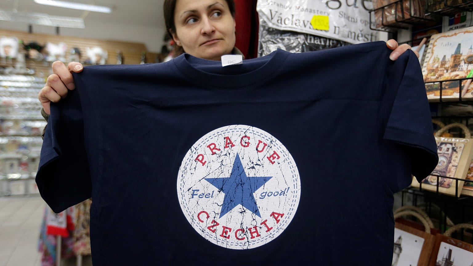 A vendor displays a t-shirt with the word "Czechia" in a store in Prague, Czech Republic, Thursday, April 14, 2016. 