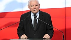The leader of the Polish ruling party, Jaroslaw Kaczynski,center, speaks to reporters in Warsaw, Poland, Saturday, Sept. 26, 2020.