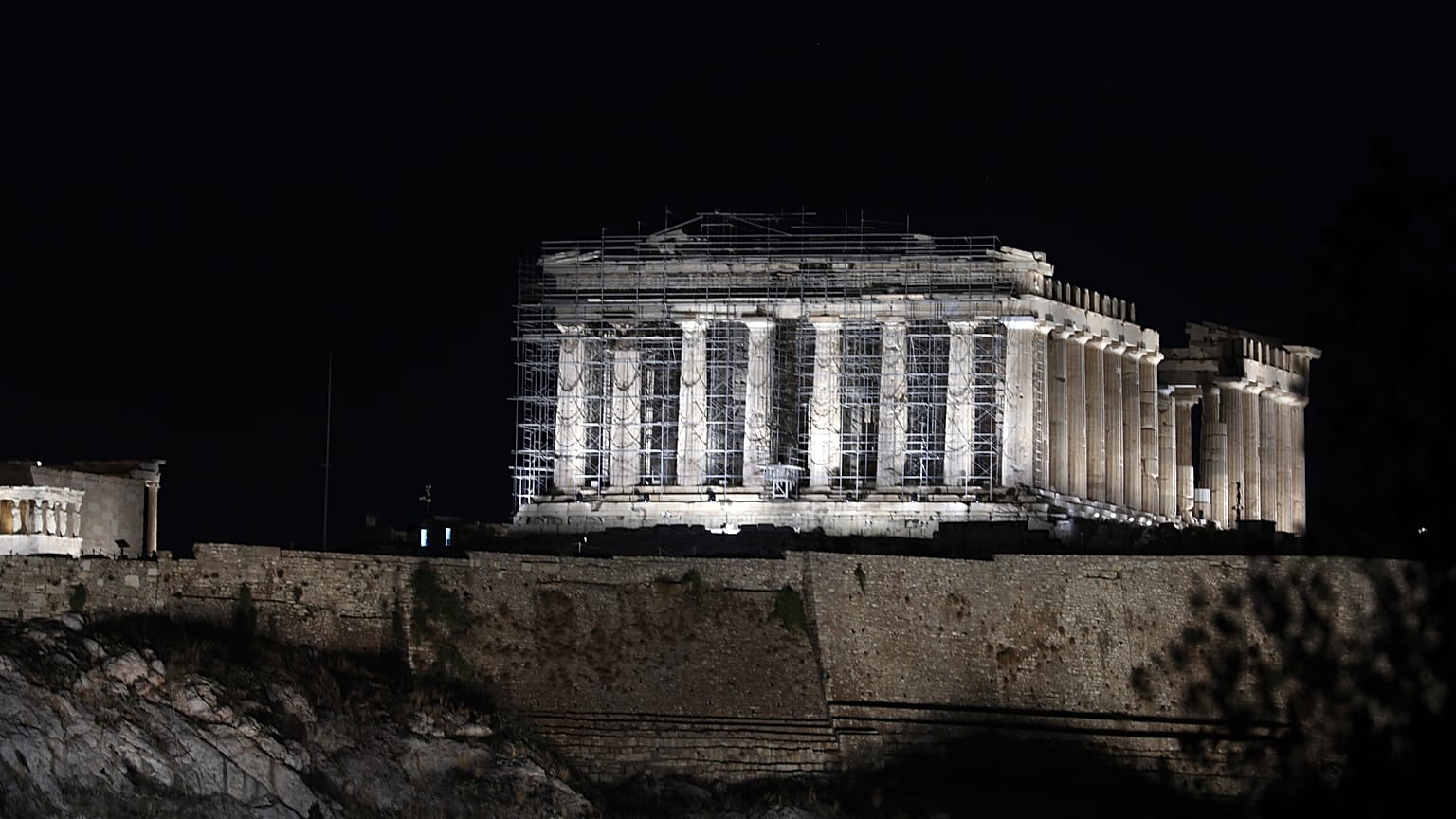 A new lighting system illuminates the ancient Acropolis hill in Athens, Wednesday, Sept. 30, 2020. 