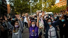 People take part in a protest to demand more resources for public health system and against social inequality in Madrid, Spain.