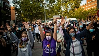 People take part in a protest to demand more resources for public health system and against social inequality in Madrid, Spain.