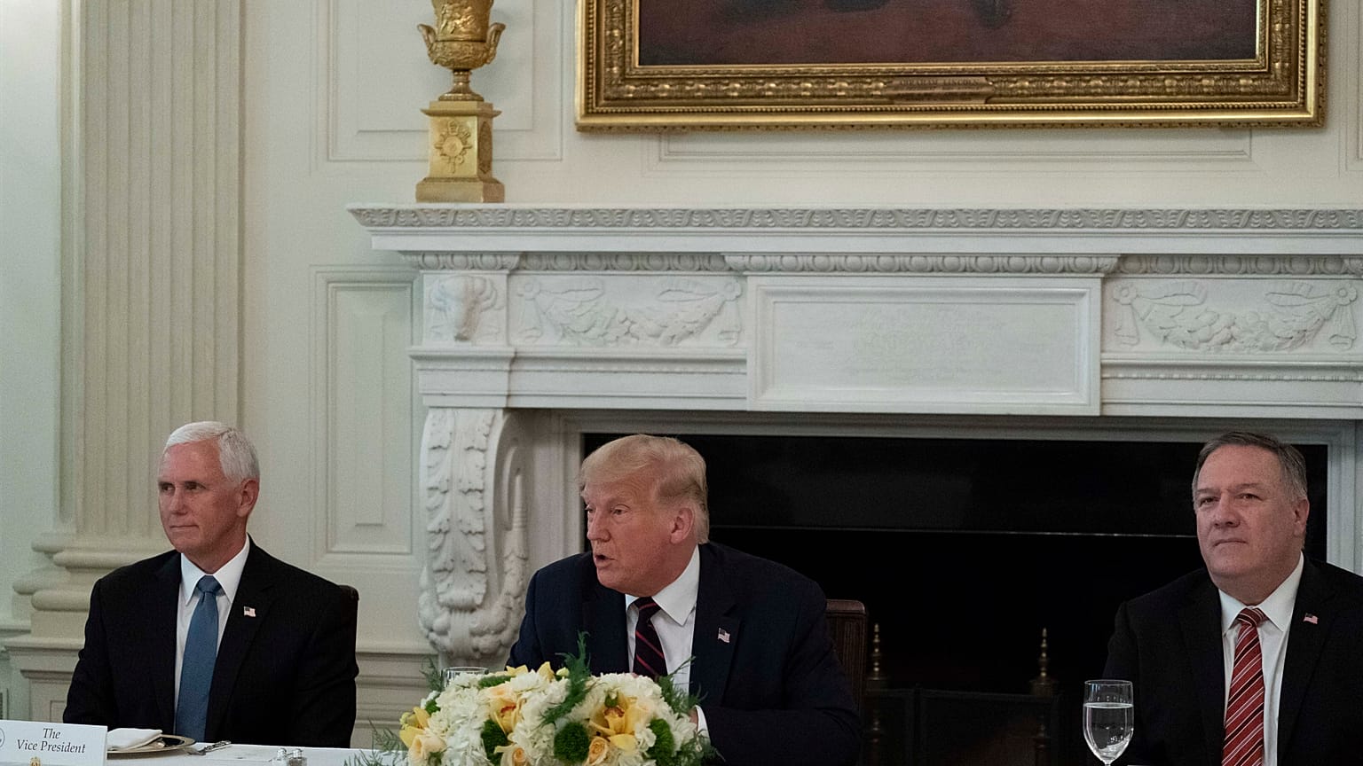 Vice President Mike Pence, and Secretary of State Mike Pompeo listen as President Donald Trump speaks 