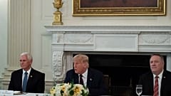 Vice President Mike Pence, and Secretary of State Mike Pompeo listen as President Donald Trump speaks 