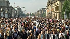 October 3, 1990, file photo, Germans stroll along the famous Unter den Linden boulevard in former East Berlin, to enjoy unification day.