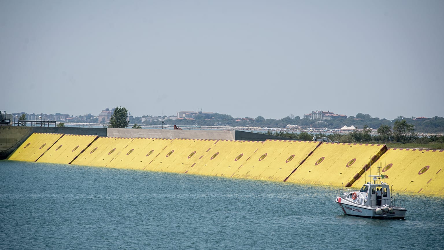 Moveable flood gates rise from the sea in the Venice lagoon, Italy, Friday, July 10, 2020. 